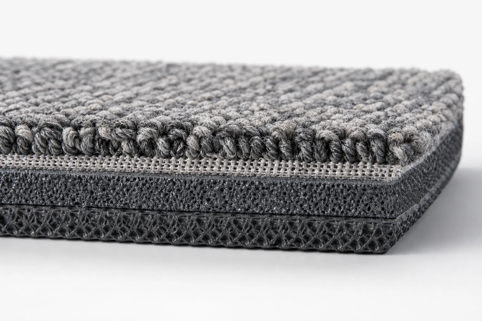 Cross-section layers of EcoCore PE backing commercial carpet tile